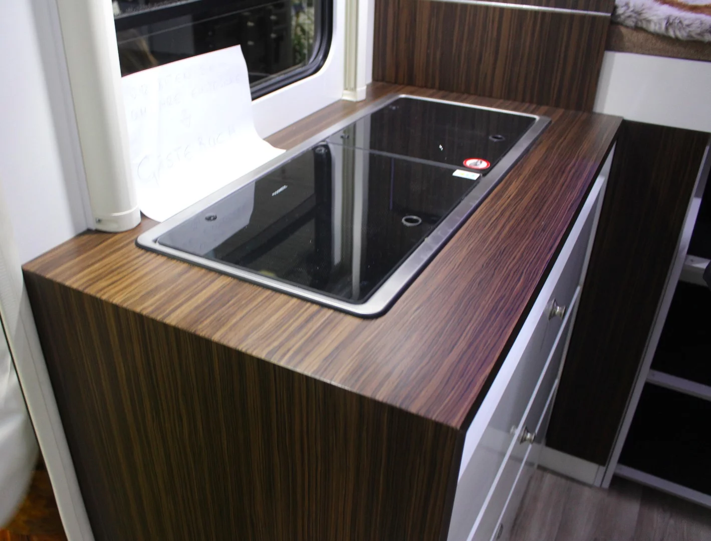 The Apéro has a simple kitchen block similar to what you might find in a camper van, with an extra tabletop available to increase work space