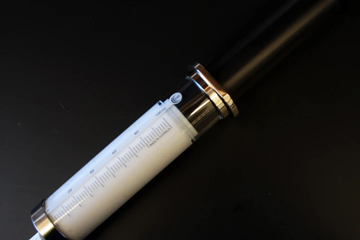 A syringe containing the oxygen microparticle solution