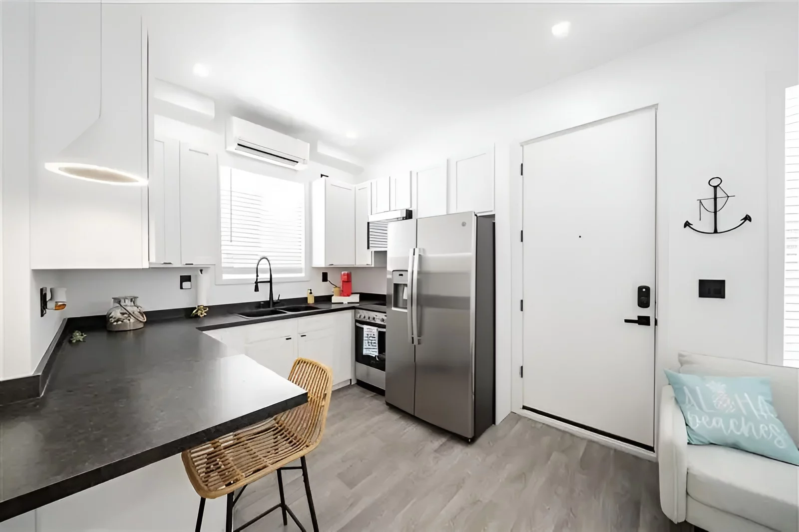 The kitchen has a full-size refrigerator and oven/stovetop