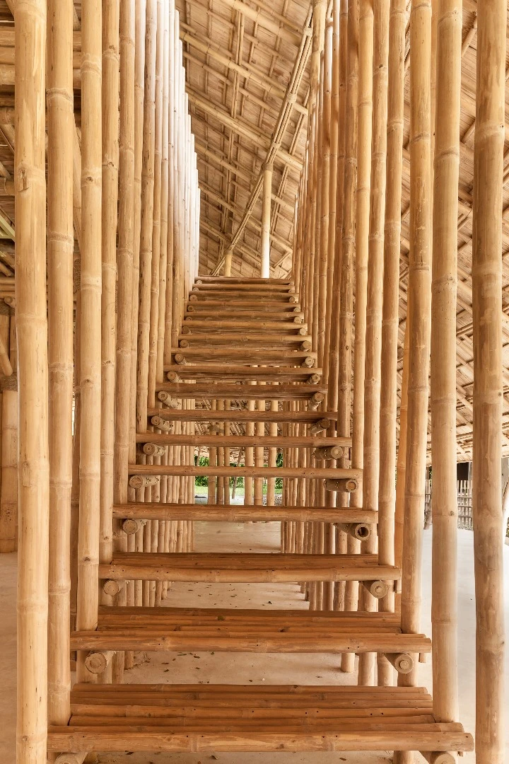Raised balconies line the Bamboo Sports Hall for Panyaden International School so that parents and spectators can watch on as events unfold
