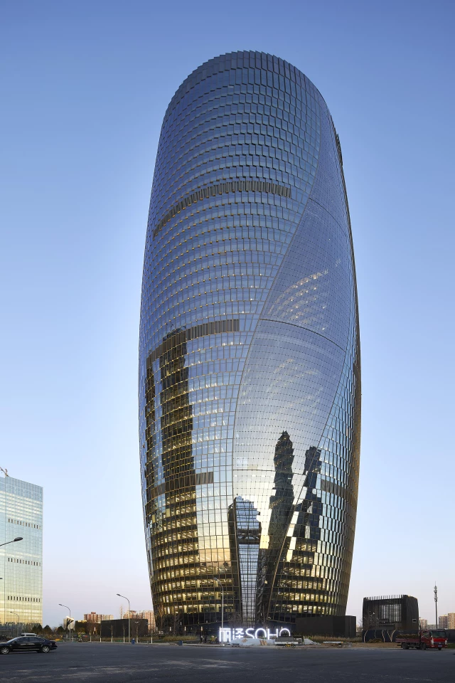 Leeza Soho, by Zaha Hadid Architects, rises to a height of 207 m (679 ft) in Beijing