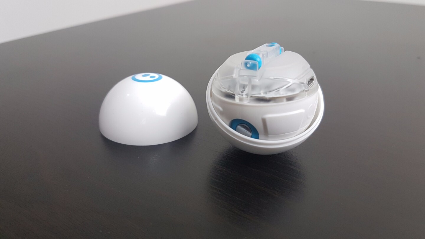 Rather than induction charging, Sphero Mini's shell cracks open to reveal a micro USB port inside