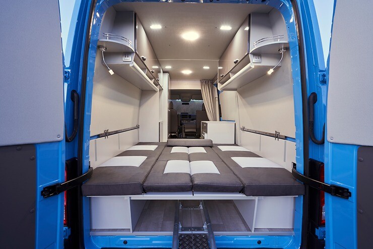 The more versatile, multi-use van of the two, this concept features a lighter camper layout with removable furniture