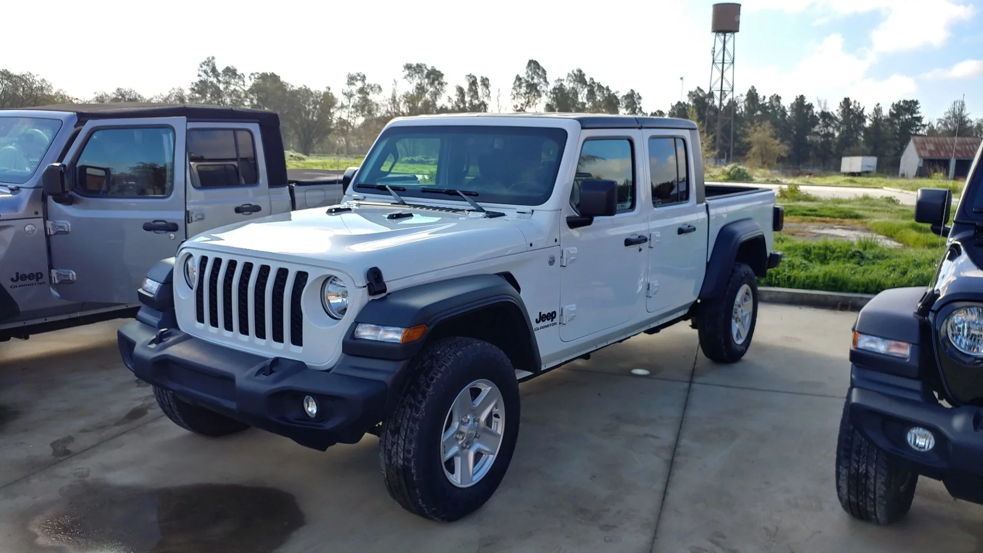 There are four grades of Jeep Gladiator, starting with the Sport and moving through the Sport S (shown), the Overland, and then the Rubicon model