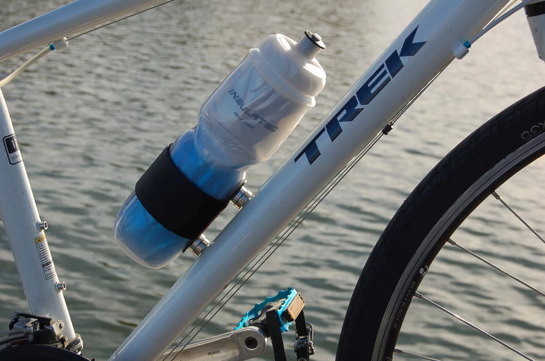 SnapFlask is strapped onto existing water bottles