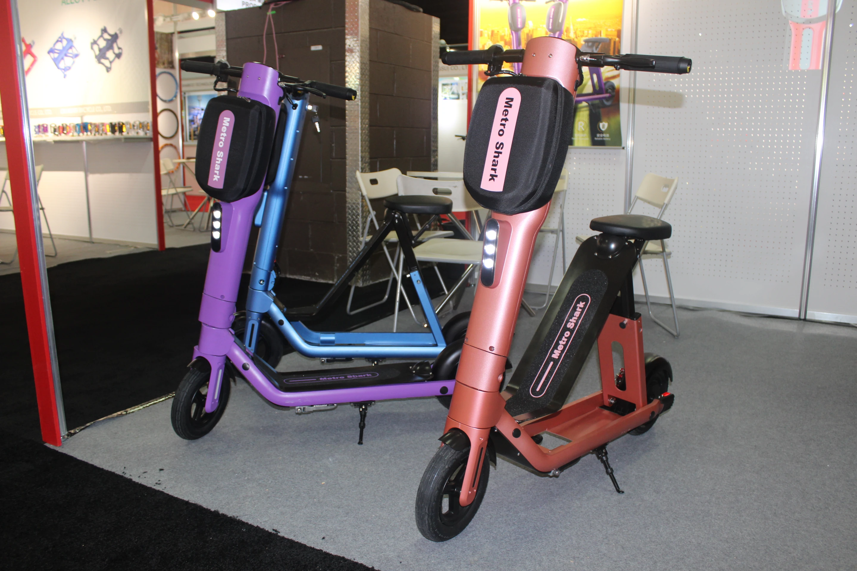 The Metro Shark in standing mode (purple) and sitting mode (red)