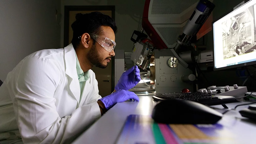 Lead author Hemant Rathod, with a sample of the self-healing ceramic material, chromium aluminum carbide