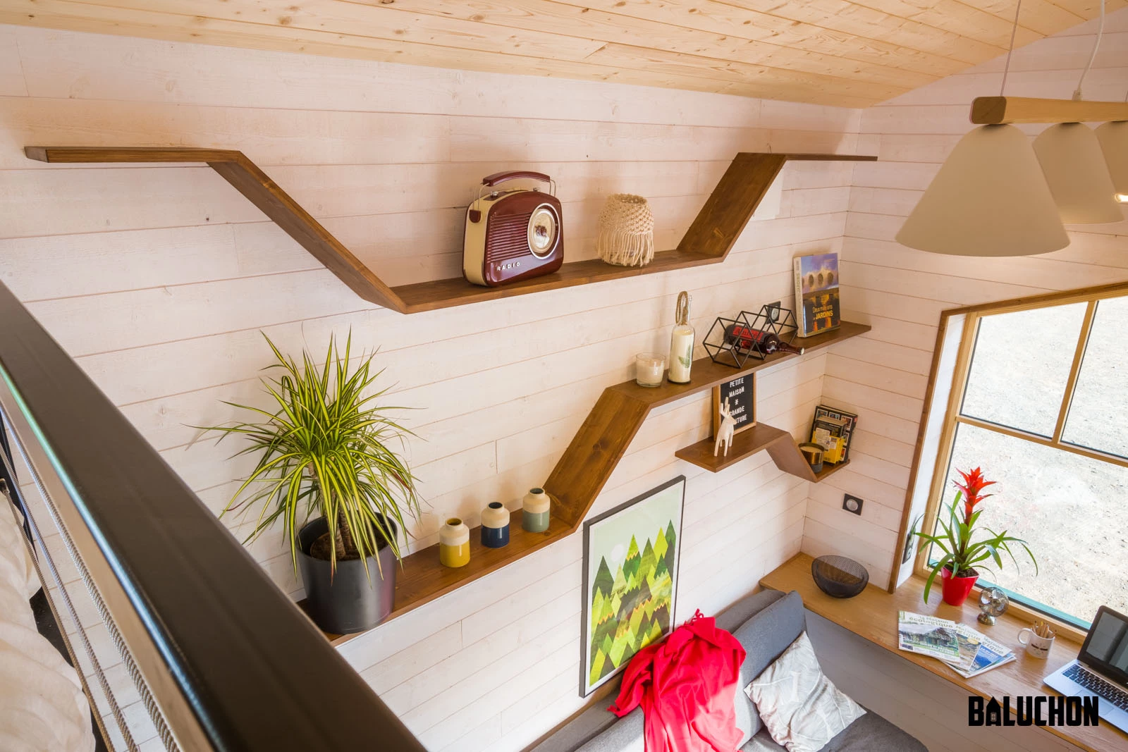 Natural light from the big window floods the living area