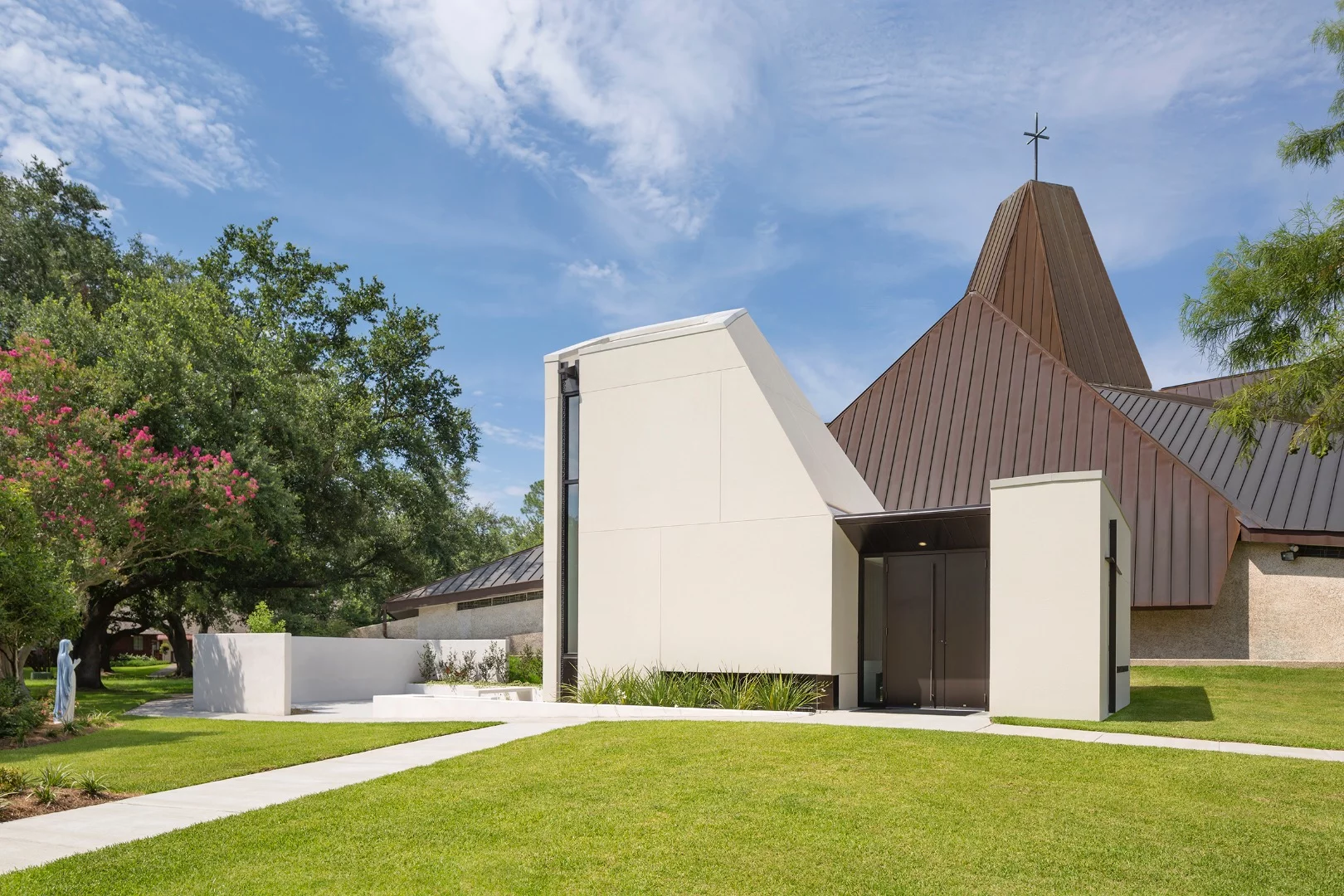 St. Pius Adoration Chapel and Prayer Garden complements and contrasts with an adjacent 1960s church