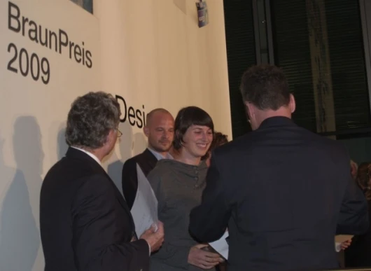 Johanna Schoemaker is congratulated by Braun's Peter Schneider and Rainer Silbernagel