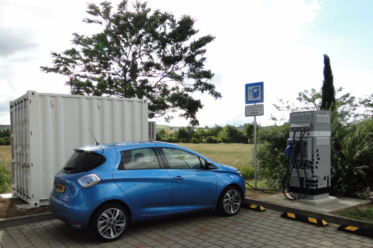 A Renault Zoe getting a quick charge from a station that uses second-life Renault EV batteries