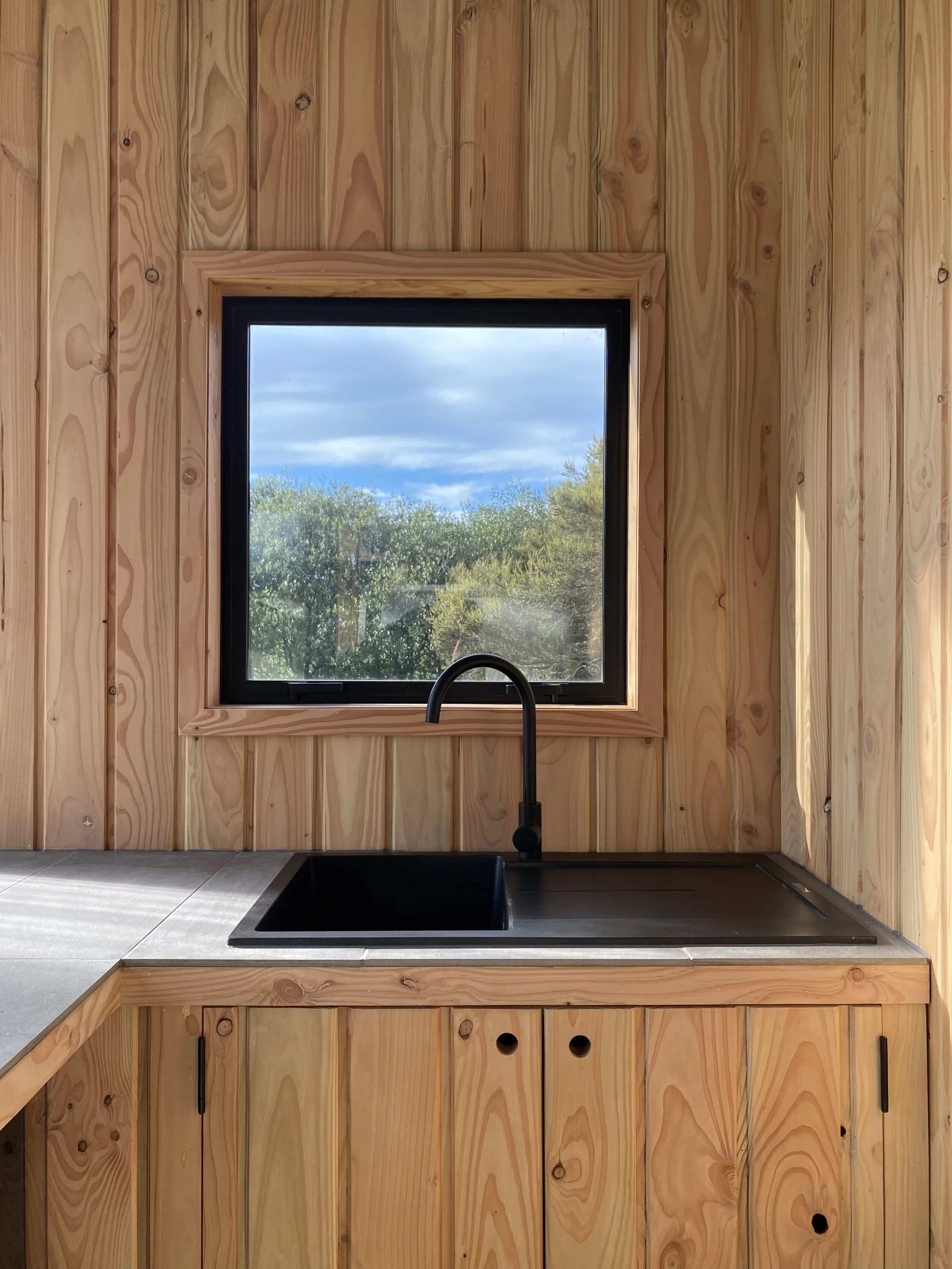 The Beach's enclosed deck area includes a basic semi-outdoor kitchen