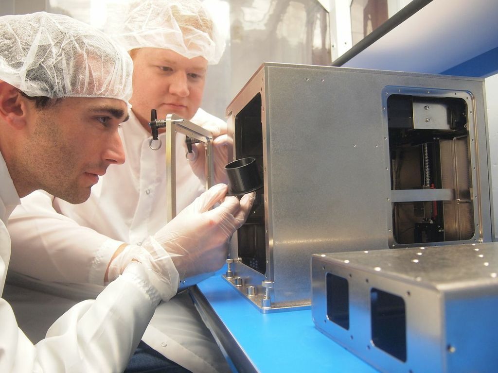 Made in Space CTO Jason Dunn (left) and Principal Investigator Mike Snyder with the 3D Print (Photo: Made in Space)