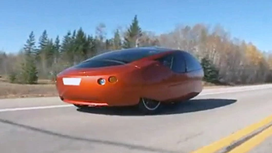 Rendering of an Urbee 2 traveling on a highway through the woods (Photo: Kor EcoLogic)