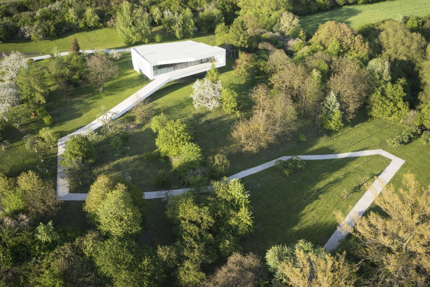 The By The Way House features a first floor wrapped in a singular looping element