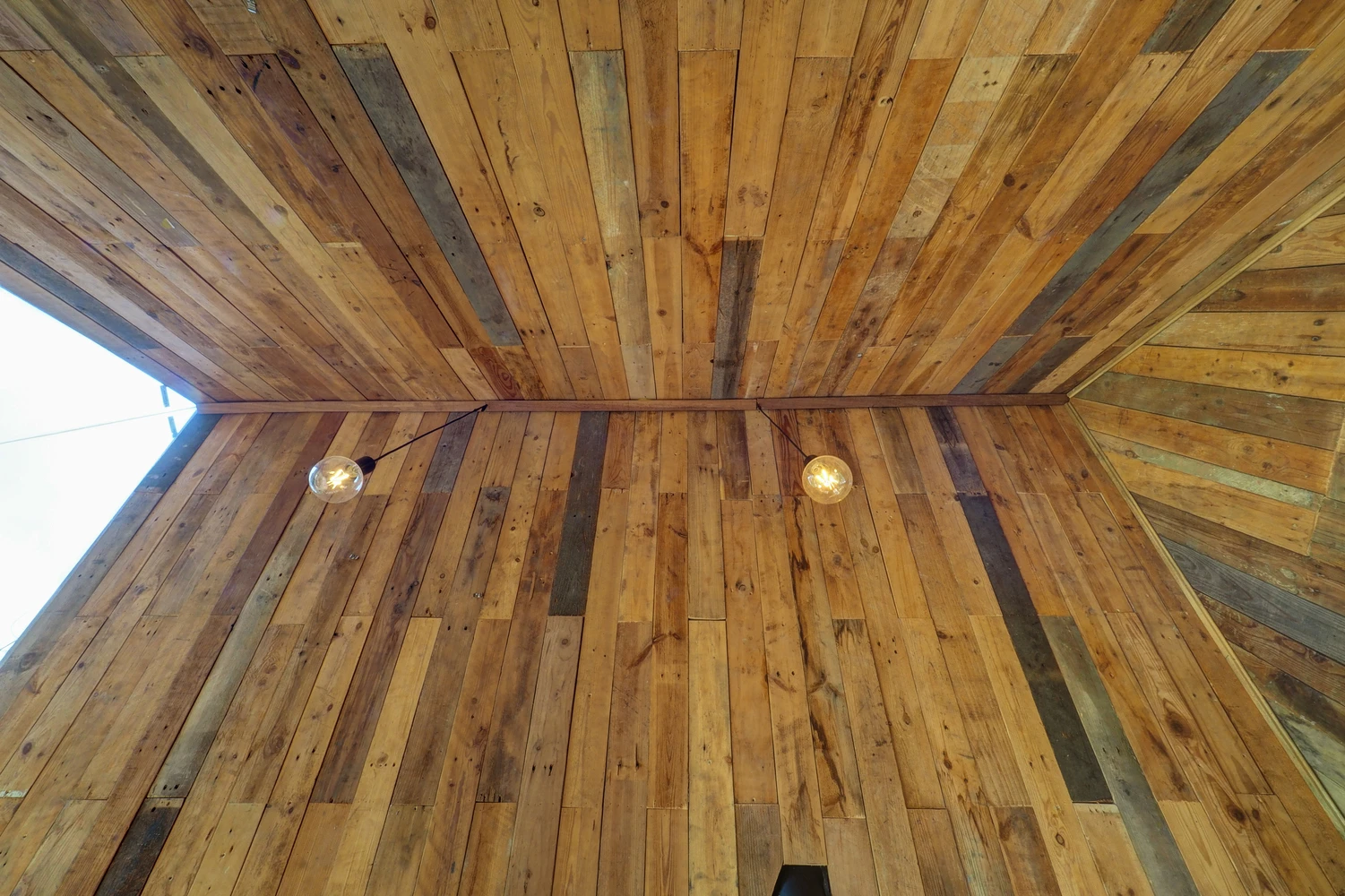 Wooden features and simple lighting inside the Forest House