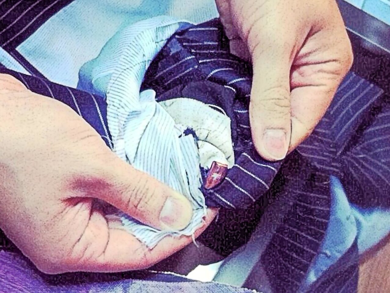A 9mm bullet stopped dead in the carbon nanotube lining of a new bulletproof suit (Photo: Garrison Bespoke)