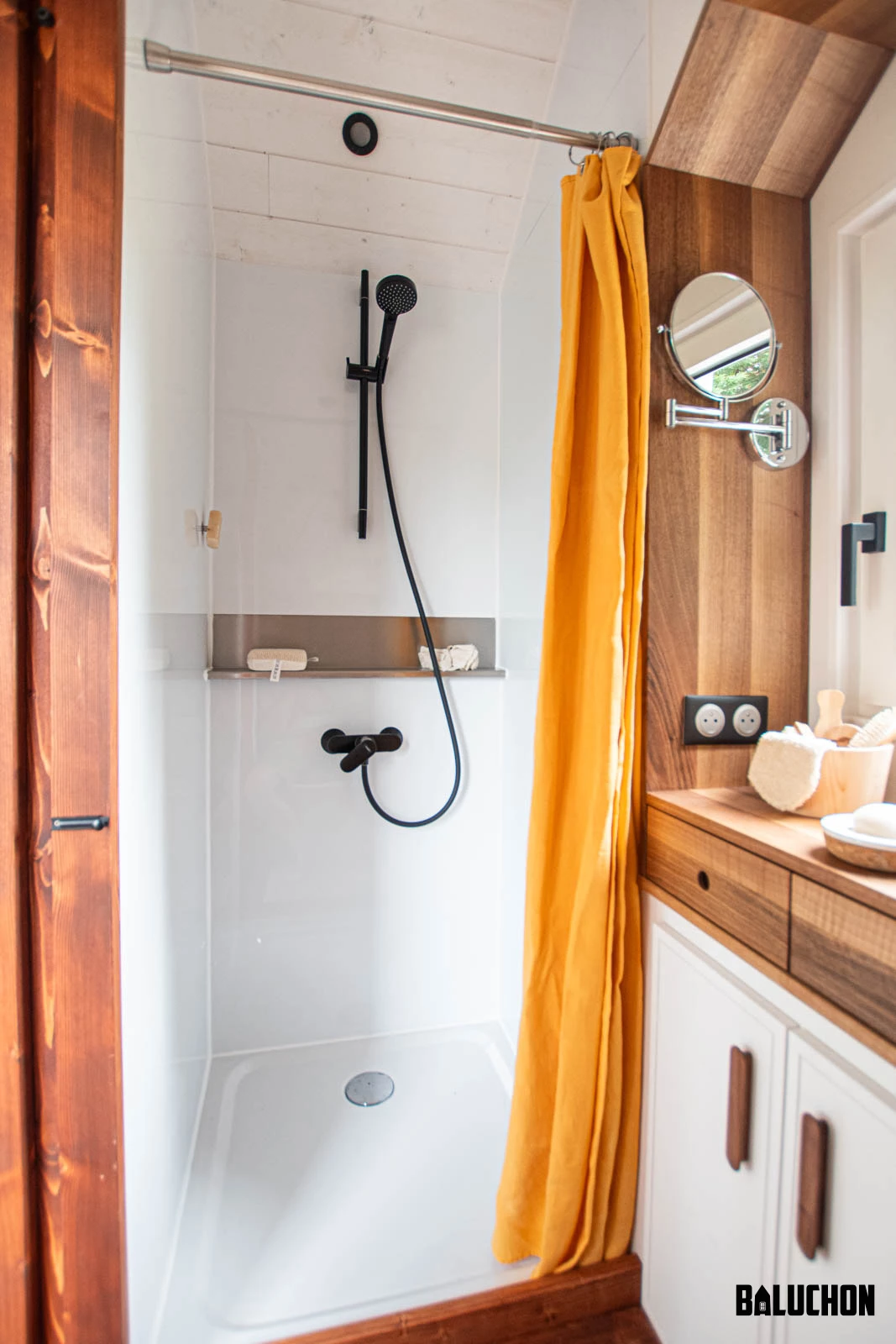 The Moulinsart's bathroom includes a shower and toilet
