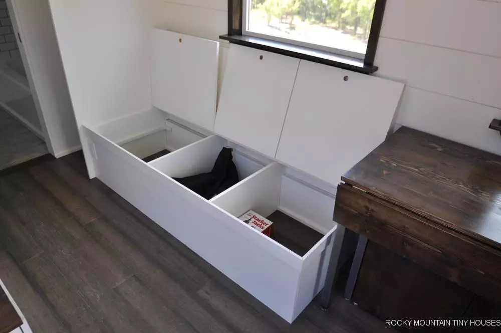 The Ad Astra's living area includes a sofa with integrated storage