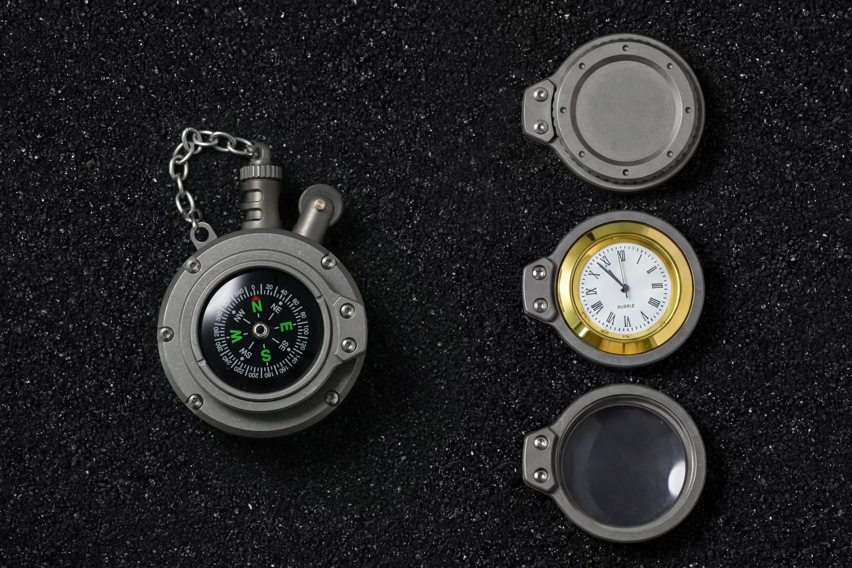 The Polar lighter alongside its capsule, watch and loupe modules