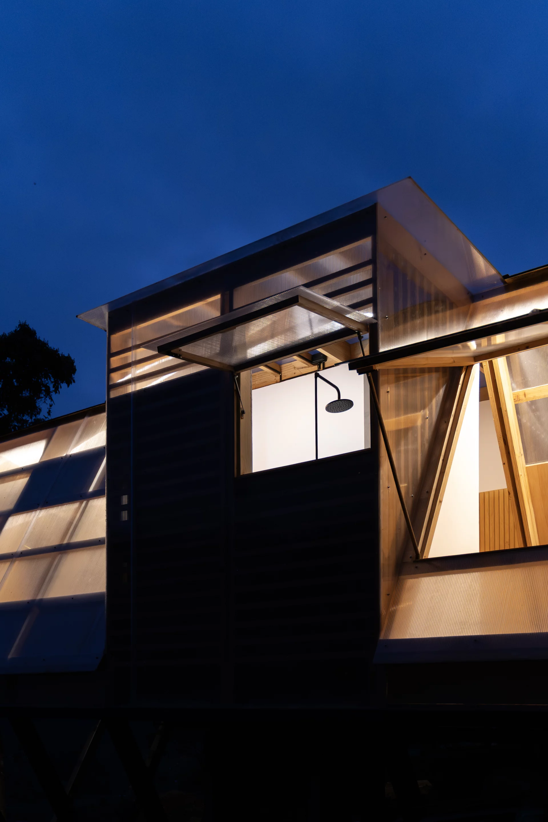 Large upward-opening shutters invite fresh mountain air deep into the interior spaces