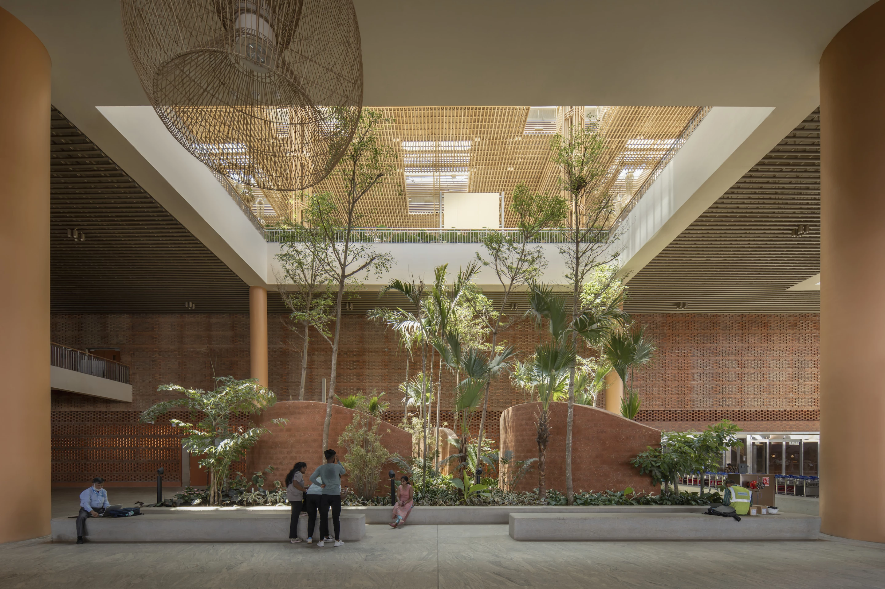Terminal 2 at Kempegowda International Airport's interior makes use of recycled and local materials like ivory brown granite, red brick and rattan
