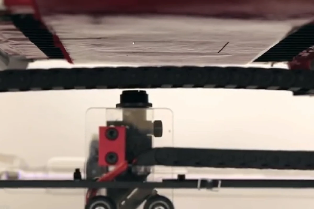A laser in the fabric printer burns shapes into material suspended by a vacuum (Photo: Disney Research)