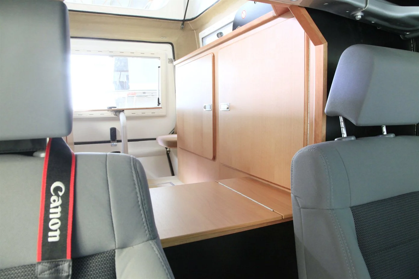 The refrigerator can be accessed from the camper and Jeep cabin
