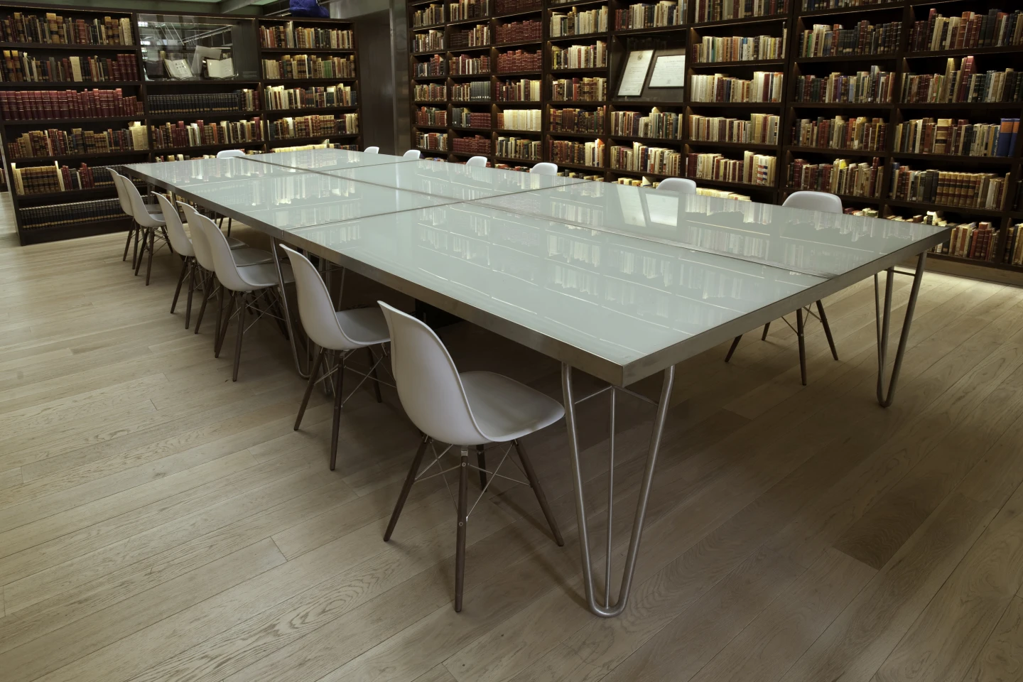 Pale floors and furniture contrast with the shelves