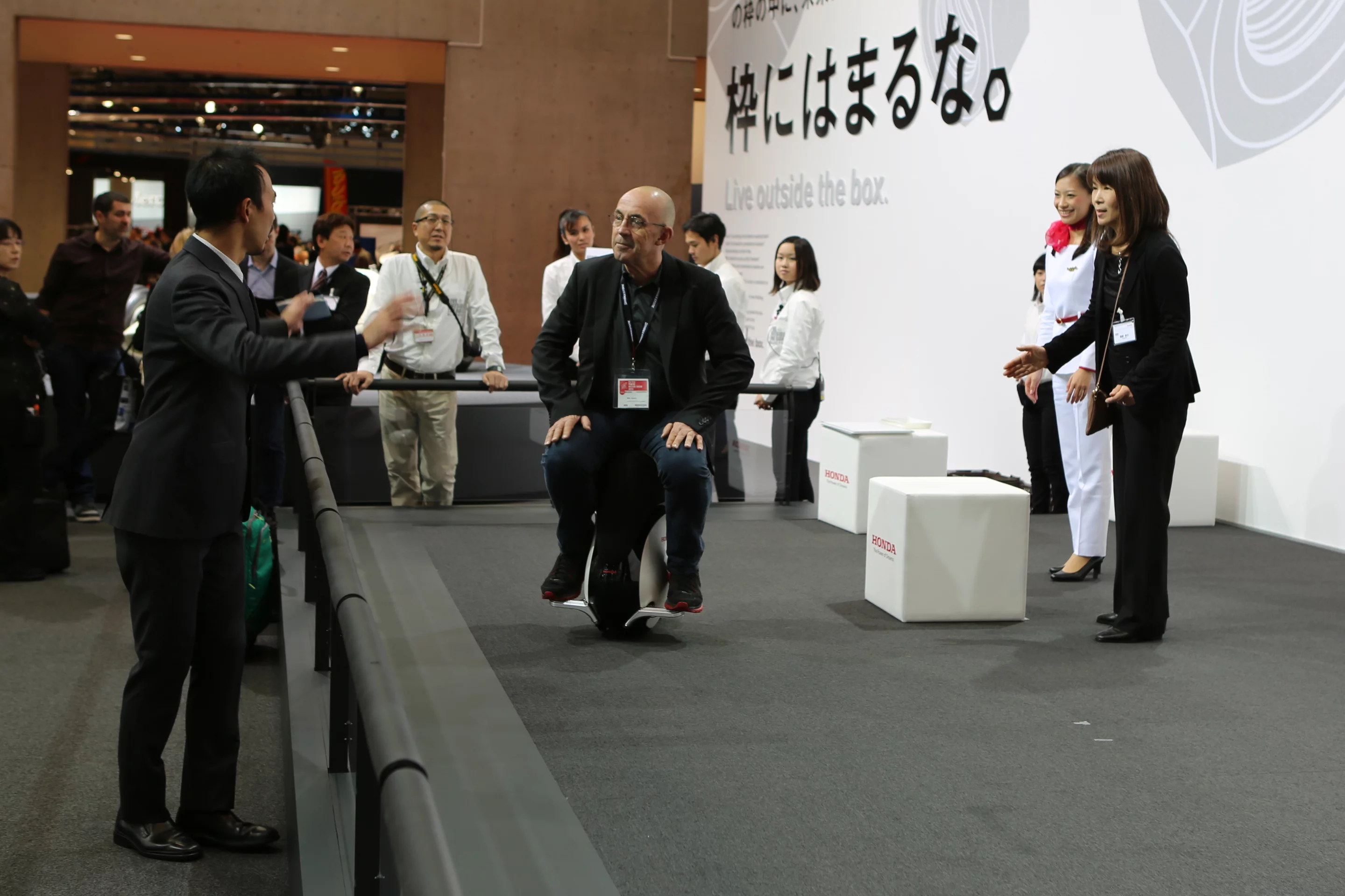 Riding Honda's UNI-CUB β (Photo: Stephen Clemenger / Lets C Design)