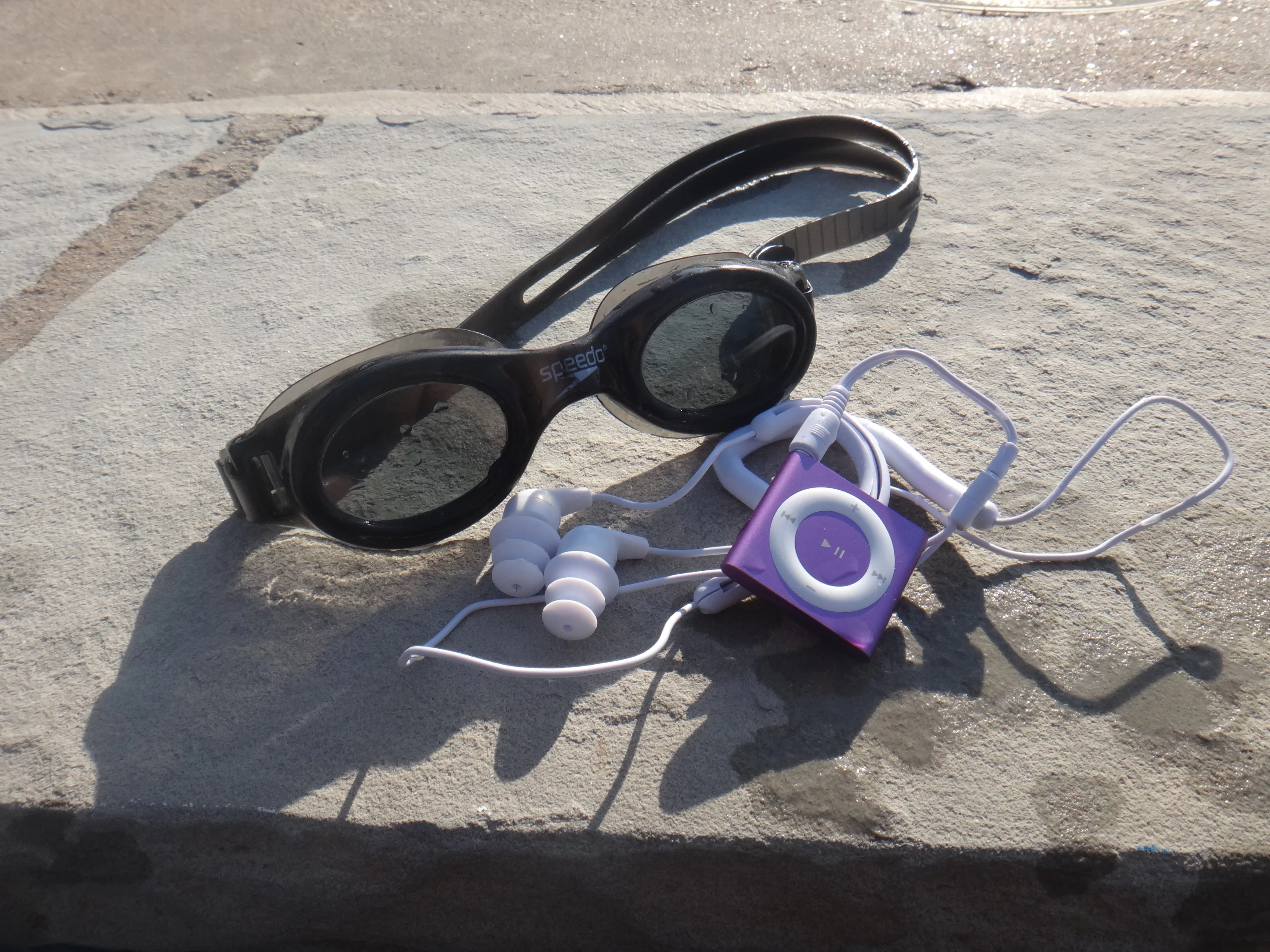 Even though this clearly wasn't Apple's intention, the clip on the back of the Shuffle is perfect for attaching it to a pair of goggles or a swimsuit strap