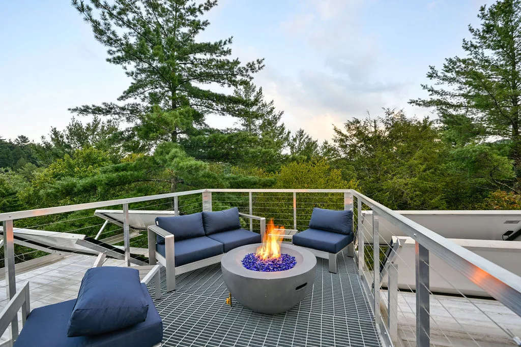 The River Forest Lookout's rooftop terrace includes some seating and a fire pit
