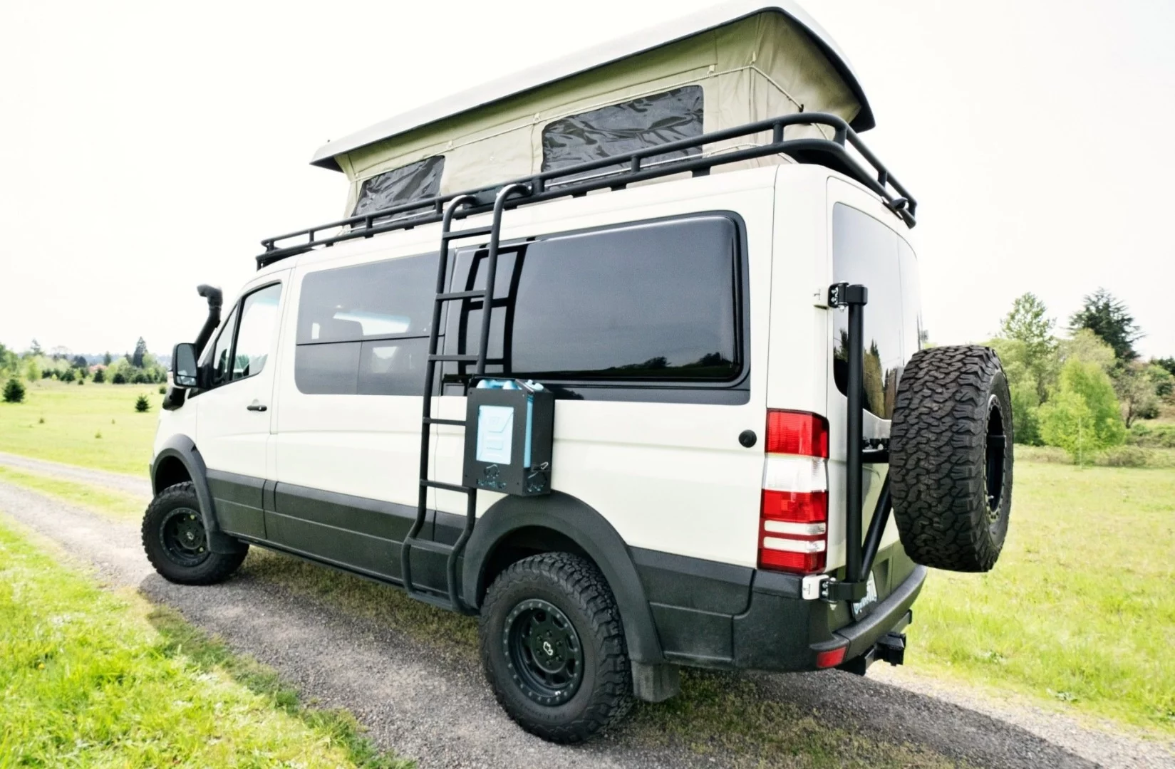 Benchmark's Swiss Army Sprinter is a $160K build-out based on a 2018 Sprinter 4x4 with Sportsmobile Penthouse pop-up roof and loads of other add-ons