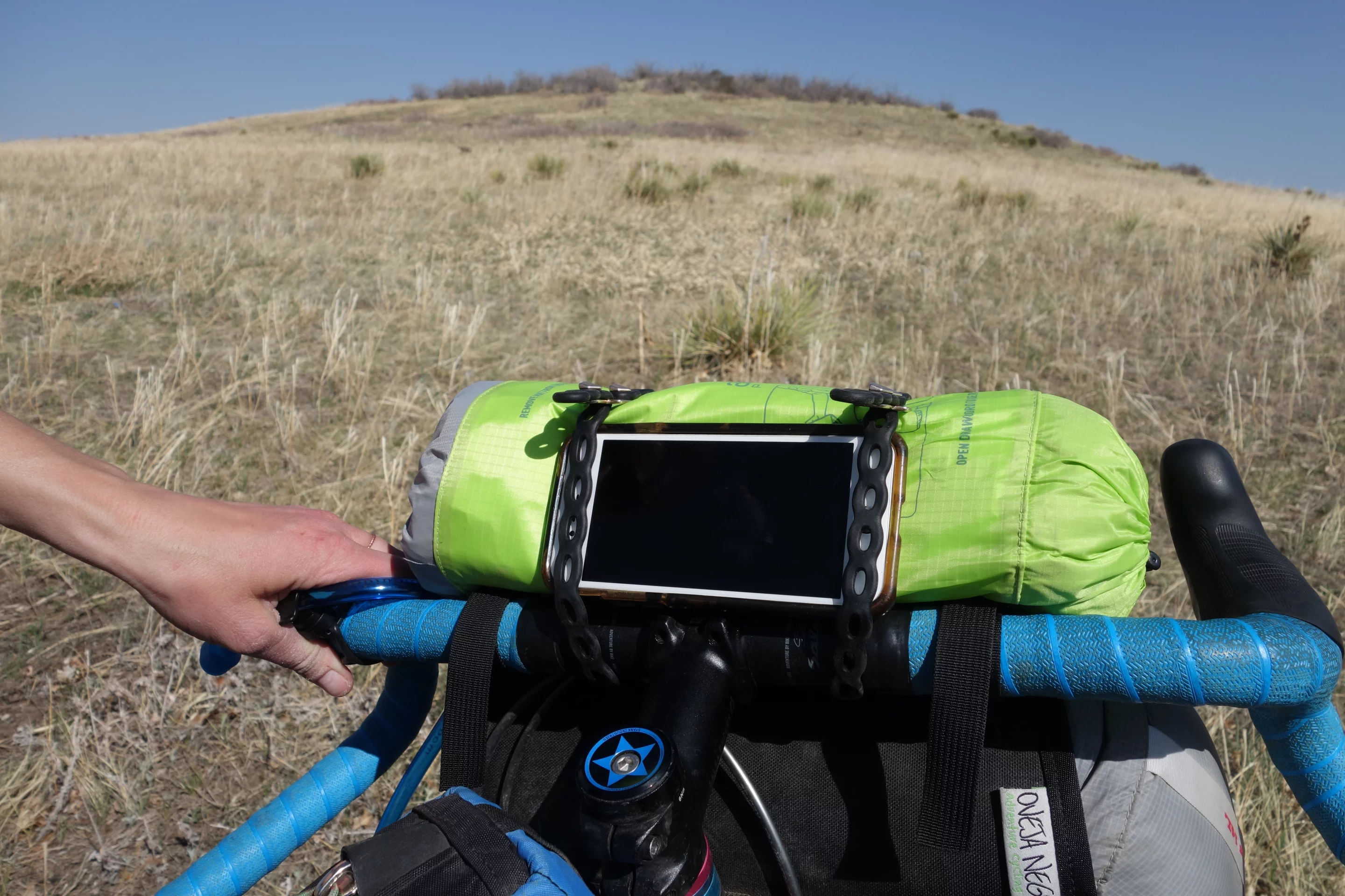 Computer and sleeping bag strapped and ready to ride