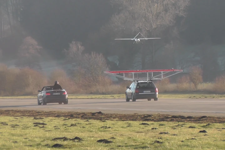 The drone coming in for an autonomous landing on a moving vehicle
