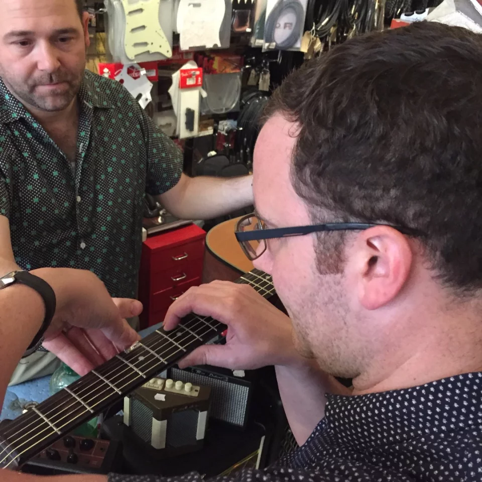 Company co-founder Jonny West installing a Fretlock