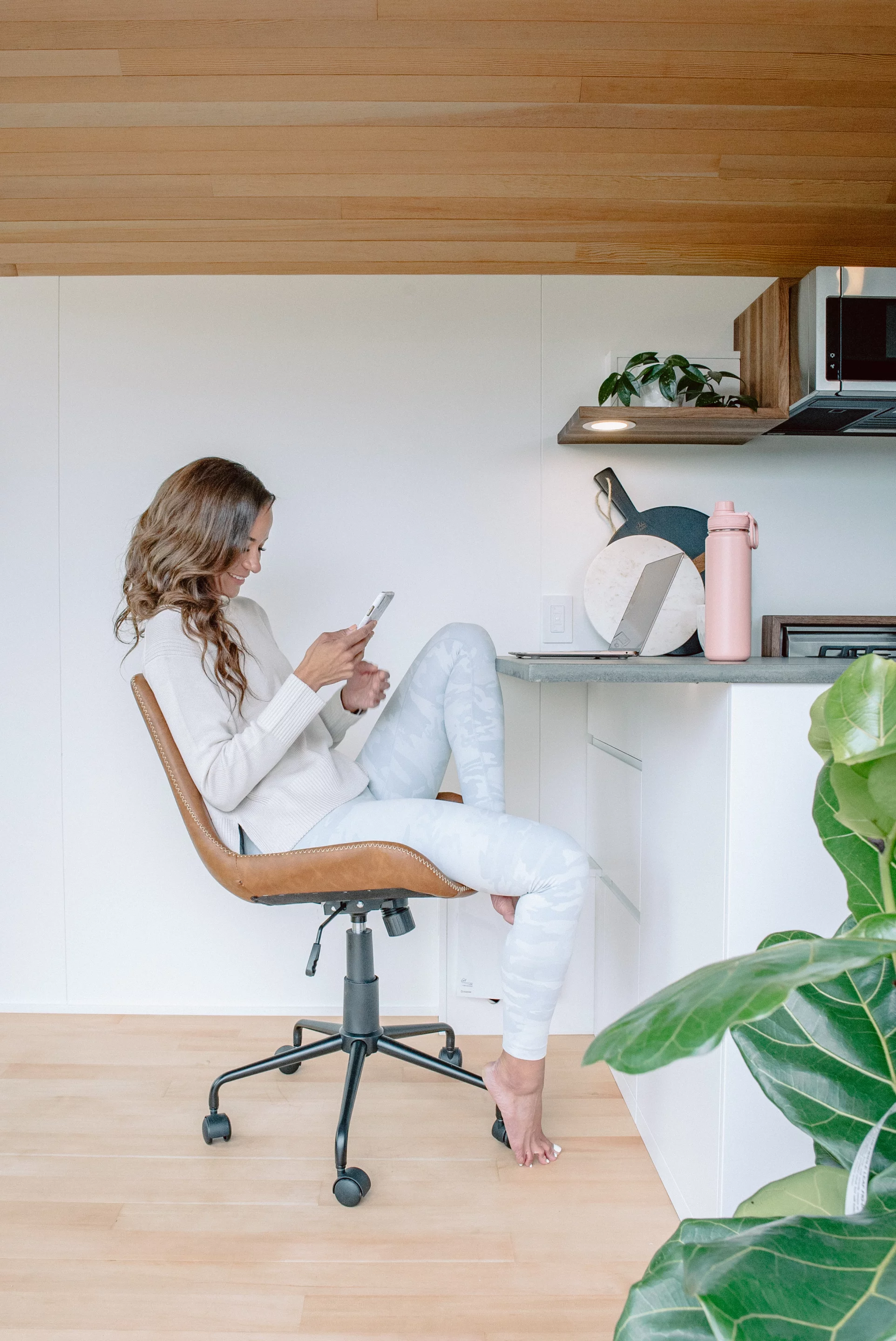 The Trahan Tiny House's breakfast bar serves as a home office area