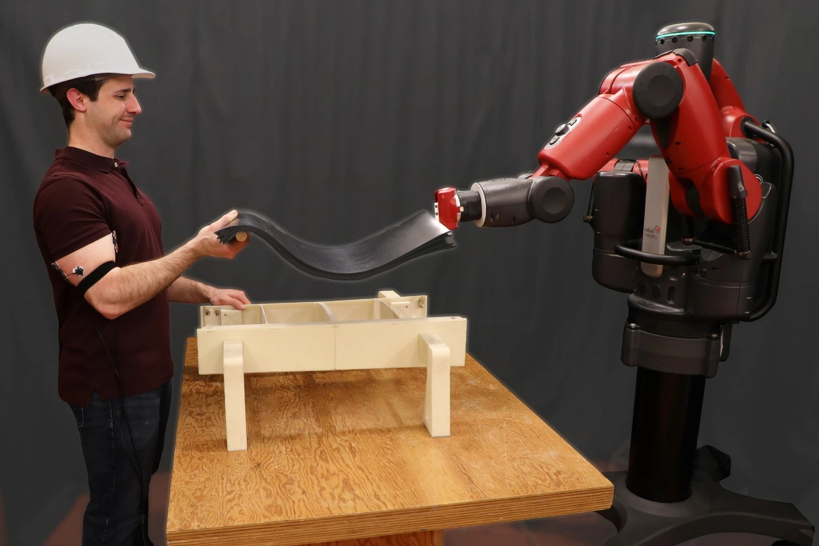 The MIT team built the RoboRaise system into its Baxter humanoid robot, and use non-invasive EMG sensors attached to a human's biceps and triceps to track muscle activity