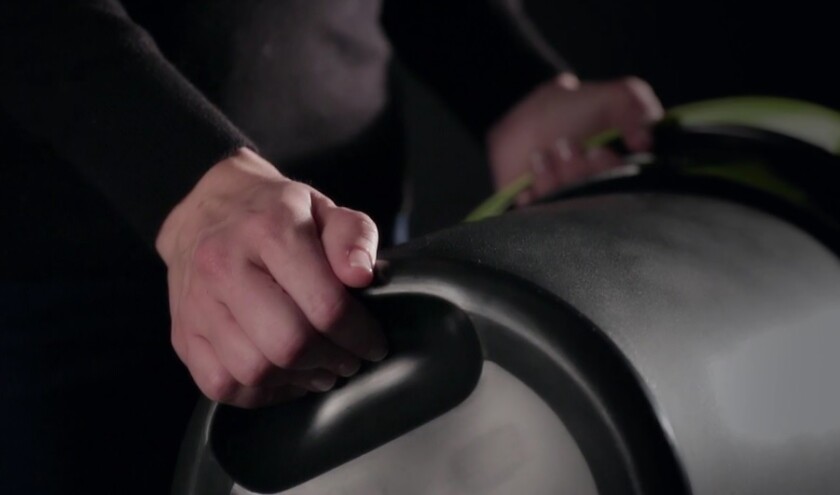 The Leaktite Big Gripper features a handgrip on the underside designed to help one person empty its contents