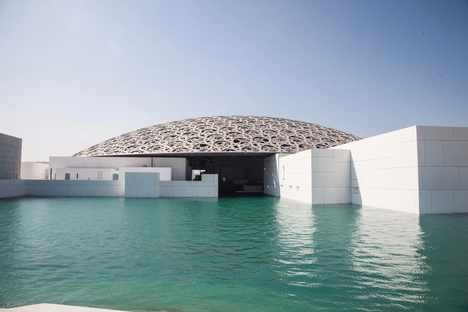 Covering most, but not all, of the buildings is the Louvre's architectural centerpiece, a massive silver dome inspired by the Arabic cupola