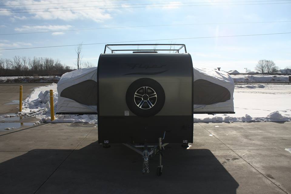Luna offers side tip-out beds for its Explore Flyer trailer, turning a rugged toy hauler into a camping trailer