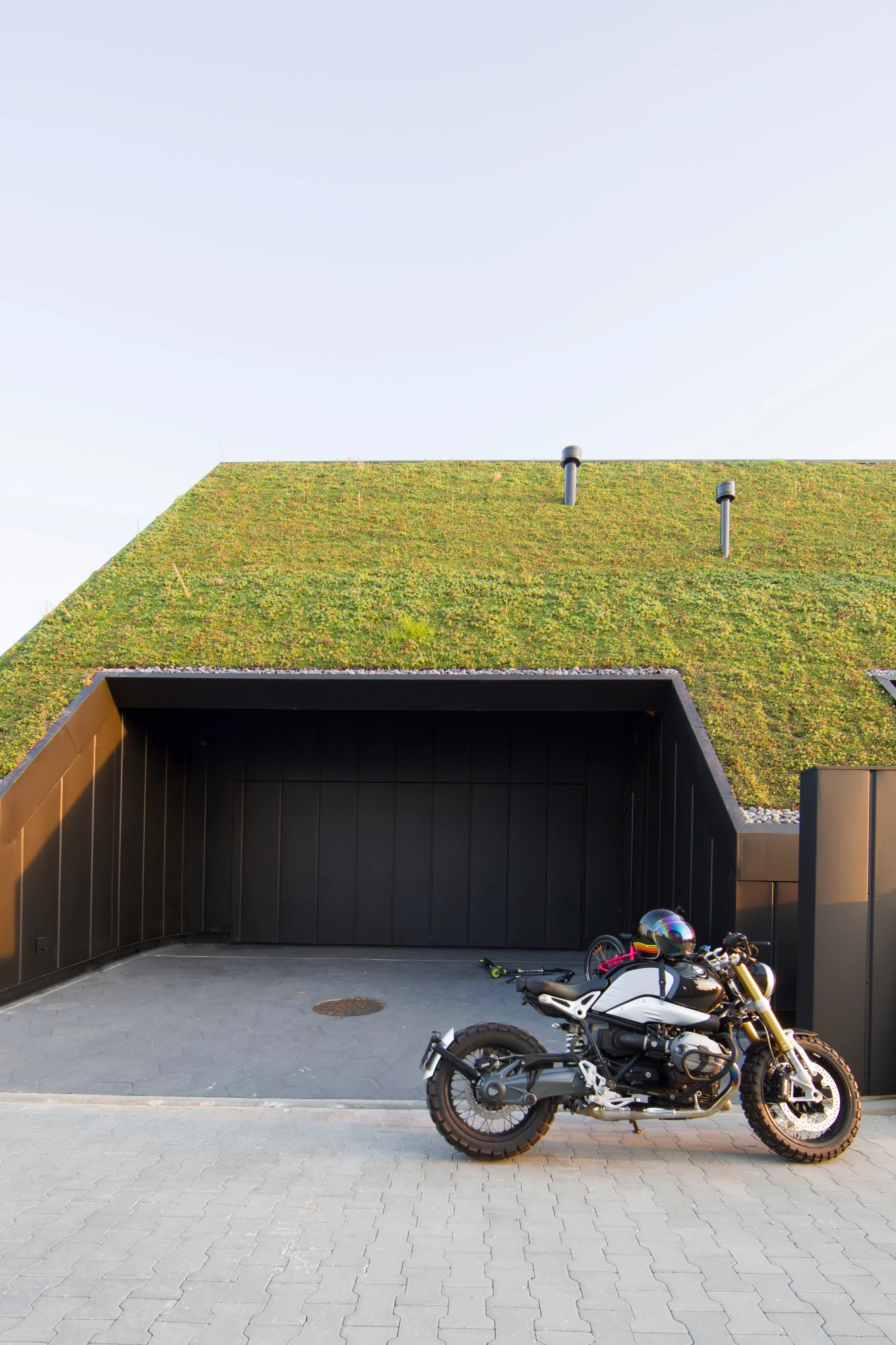 Superhelix Pracownia Projektowa says that local public transport links are very poor so the firm integrated a garage into the home