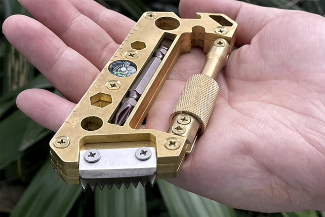 The AX03 with its saw blade flipped and extended for use