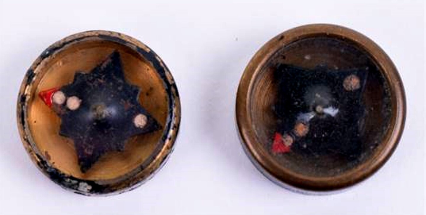 A button compass used by spies and escaped POWs