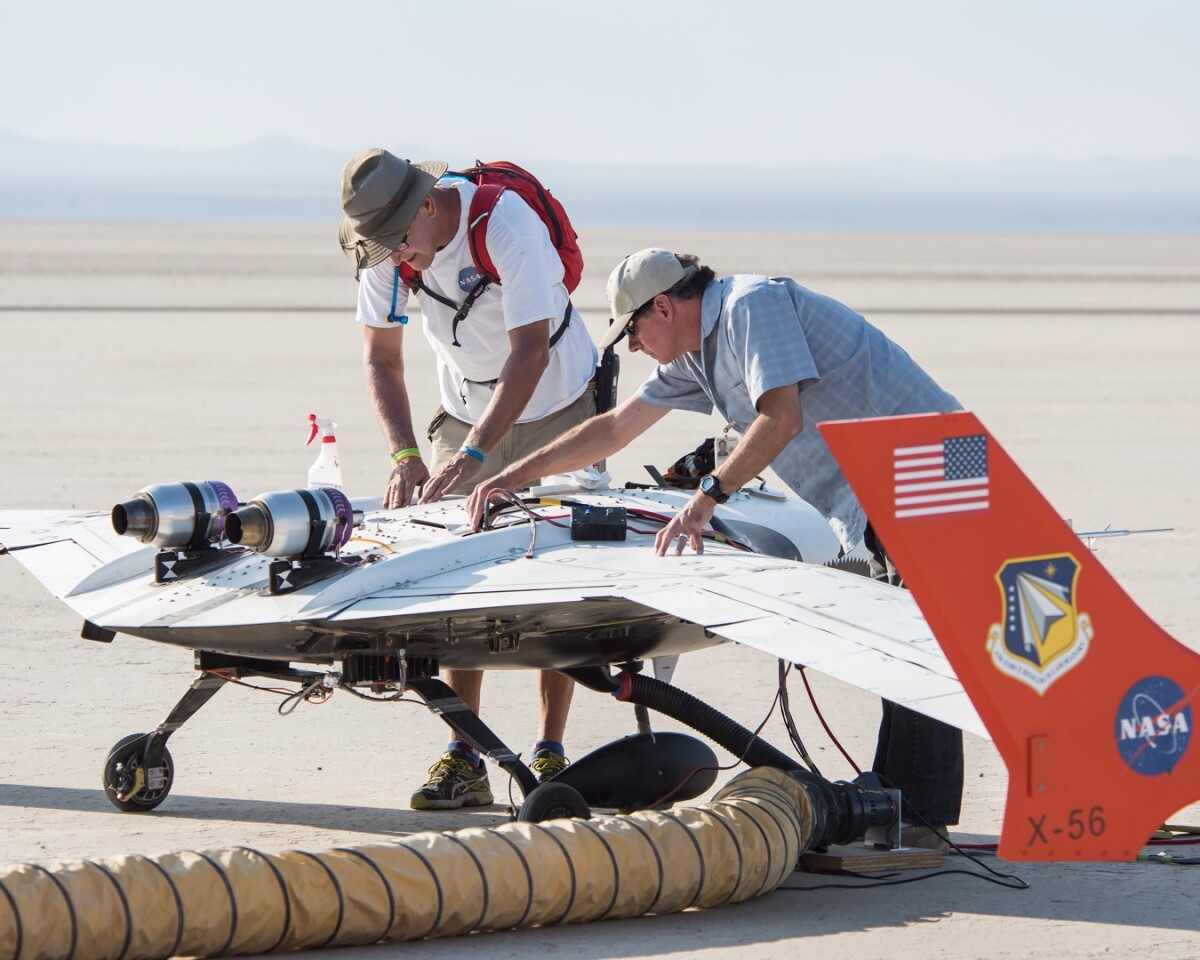 James Smith and Gary Cosentino prepare the X-56A for flight. Researchers are using the aircraft to investigate if highly-flexible, lightweight wings can be controlled.