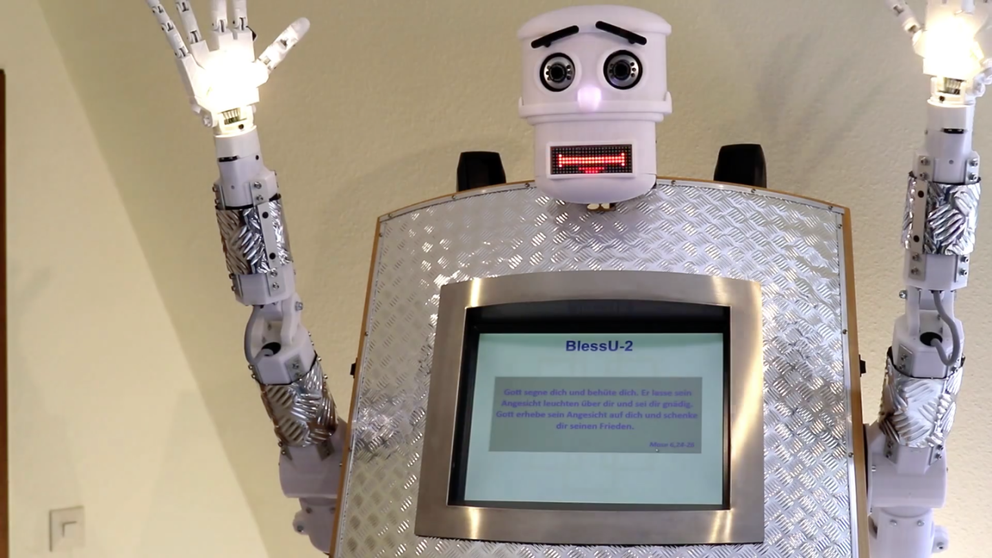 The robot, named BlessU-2, features a head, two arms and a light