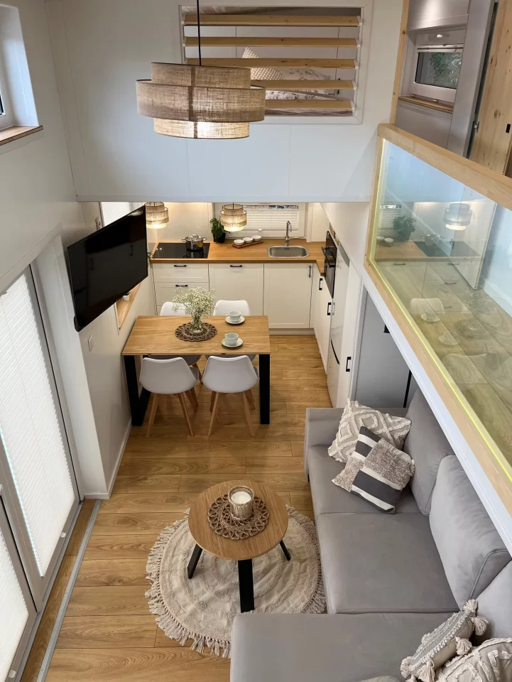 The River tiny house's living room occupies the center of the home