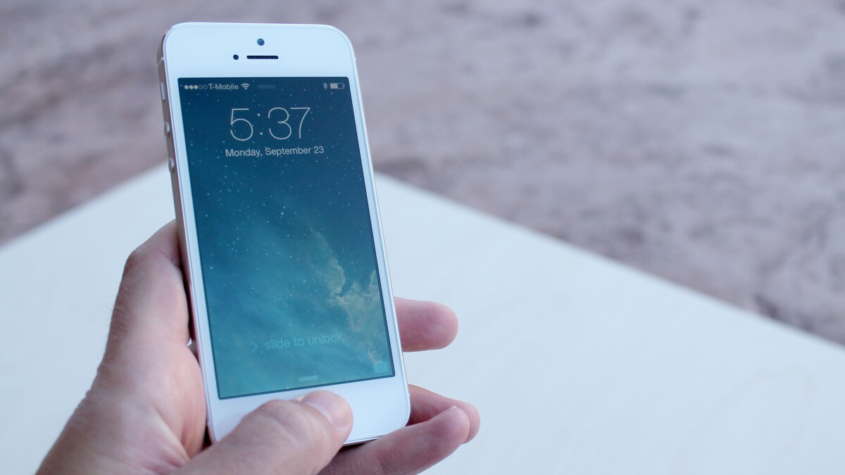 Hold your finger on the home button for a brief moment, and your iPhone 5s will unlock
