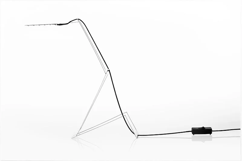 Masiosare Studio's Flaca low-energy, stainless steel desk lamp can be bent into shape with the user's bare hands