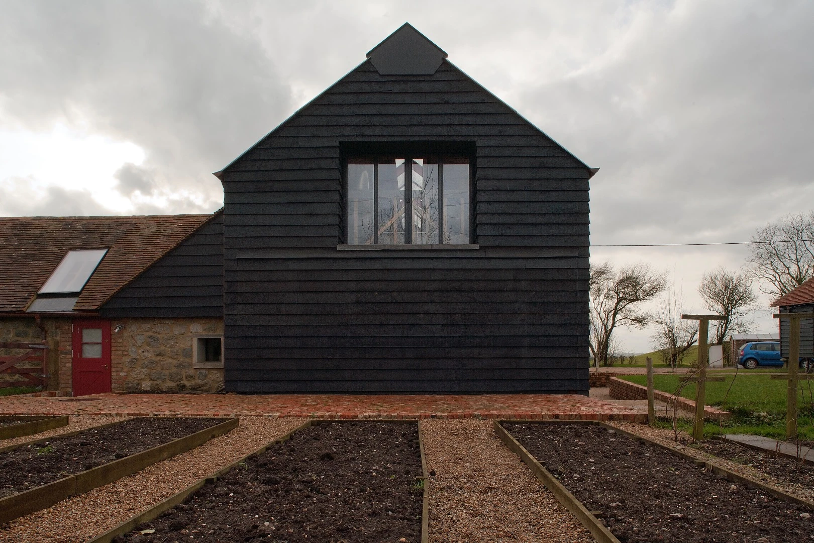 Ancient Party Barn comprises a cluster of agricultural buildings, most notably an 18th Century threshing barn
